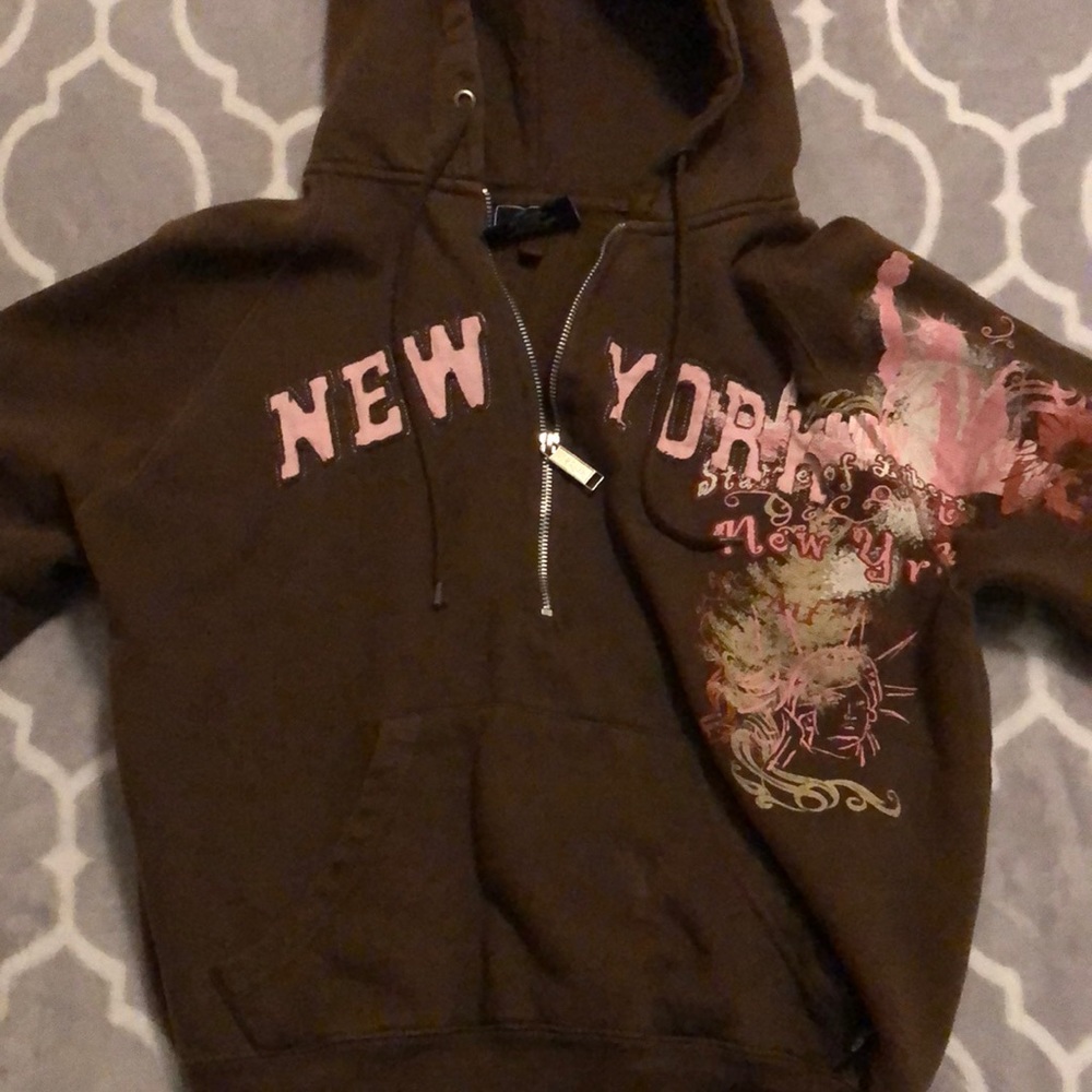 Brown New York hoodie.